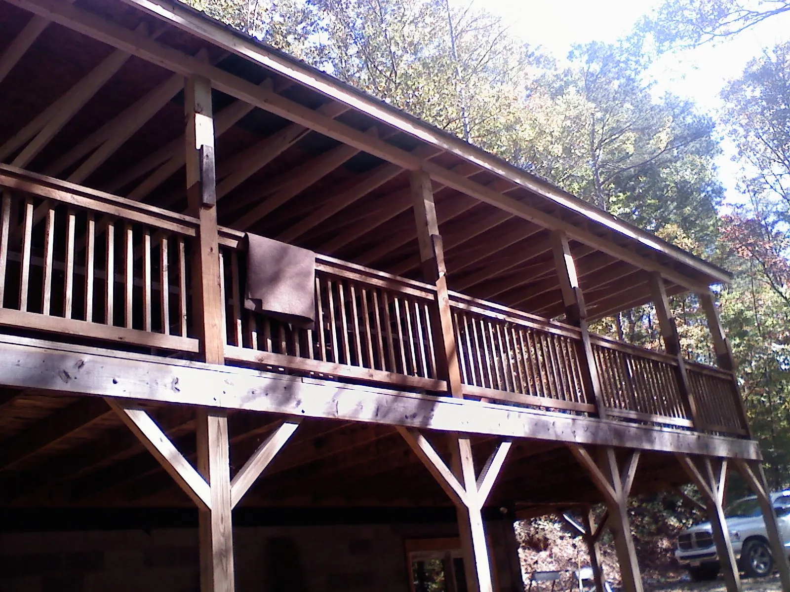 Timber framing under a new elevated porch and deck — Roof Leak Repair in Stanford by Roofing Brothers